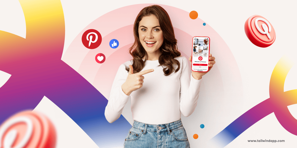 A woman in a white shirt and jeans smiles, holding a phone displaying Pinterest homepage on a light pink background and multicolored swirls with Pinterest logo and Tailwind url.